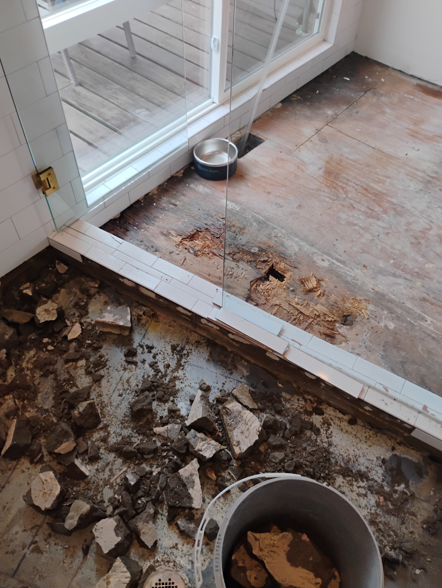 Bathroom demolition and damaged flooring